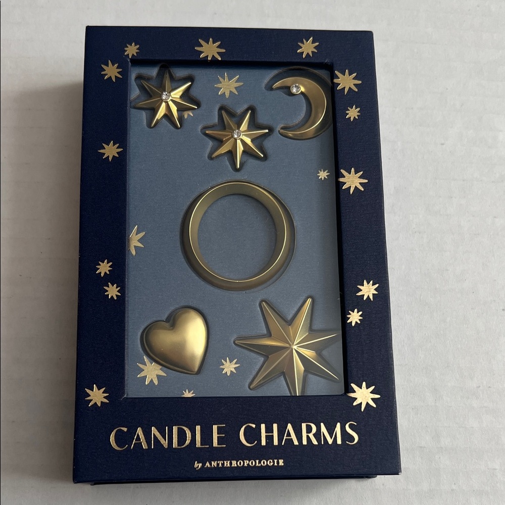 O initial Anthropologie Gold Star and Moon Candle Charms